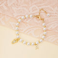 Baby Keepsake Pearl Bracelet with Name Foot and Initial Charm - Glaxias